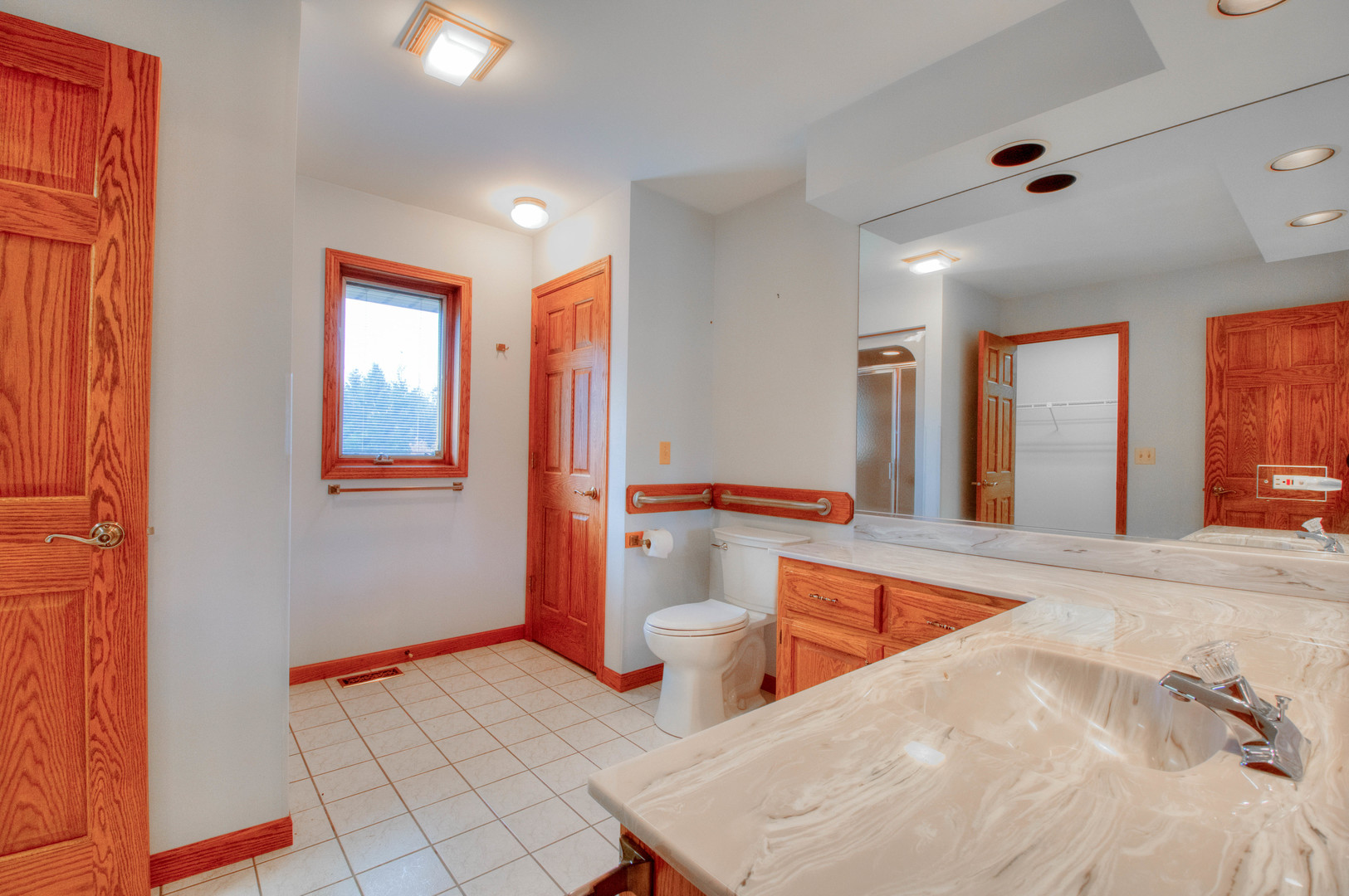 20501 Hebron Road Harvard, IL 60033 - Photo 25 of 49 a bathroom with a sink and a large mirror