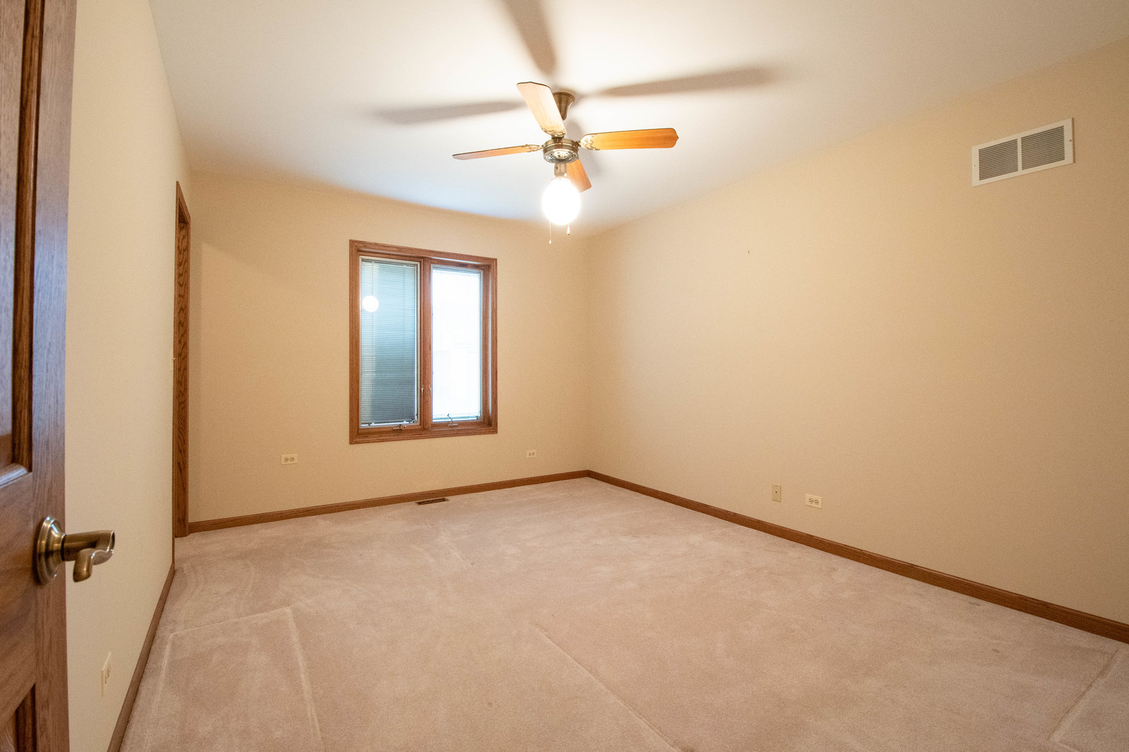 20501 Hebron Road Harvard, IL 60033 - Photo 28 of 49 an empty room with a ceiling fan and window