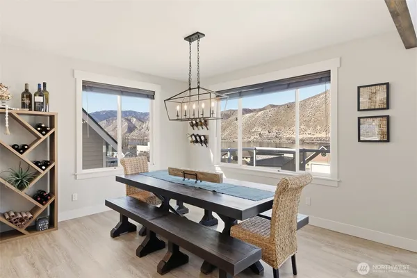 a view of a dining room with furniture window and wooden floor