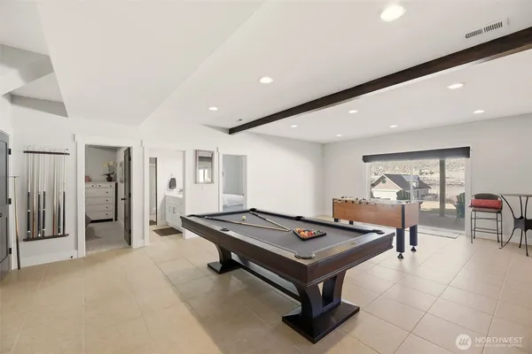 a room with furniture and air hockey table