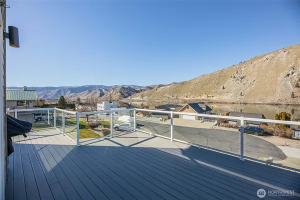 a view of a terrace with wooden floor and city view