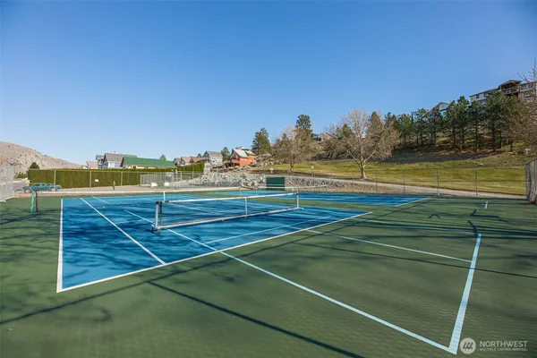 a view of an outdoor space and tennis court