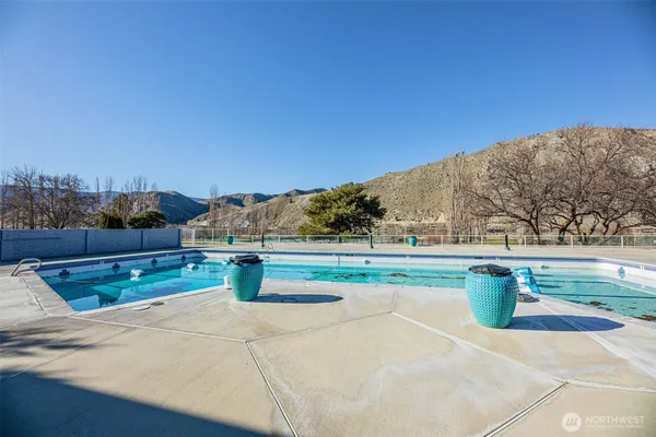 a view of swimming pool with a yard