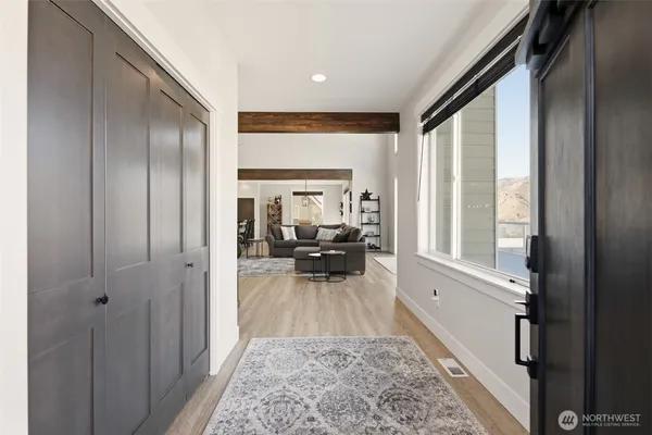 a living room with furniture and a large window