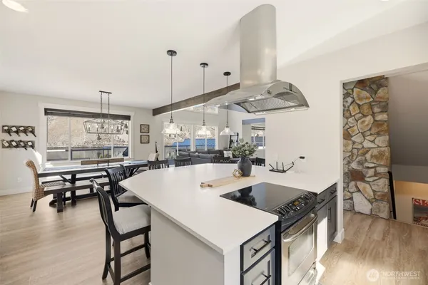 a large kitchen with a table and chairs