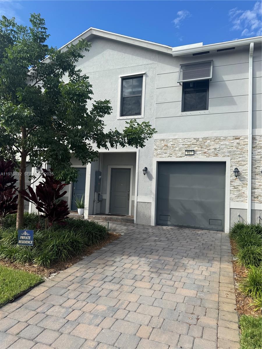 817 Northwest 3rd Way Pompano Beach, FL 33060 - Photo 1 of 13 a front view of a house with yard