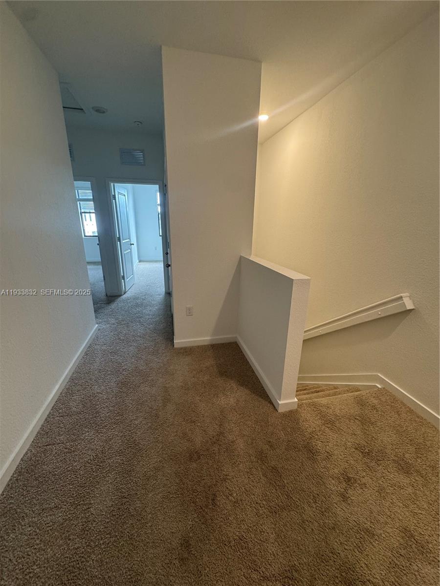 817 Northwest 3rd Way Pompano Beach, FL 33060 - Photo 9 of 13 an empty room with windows