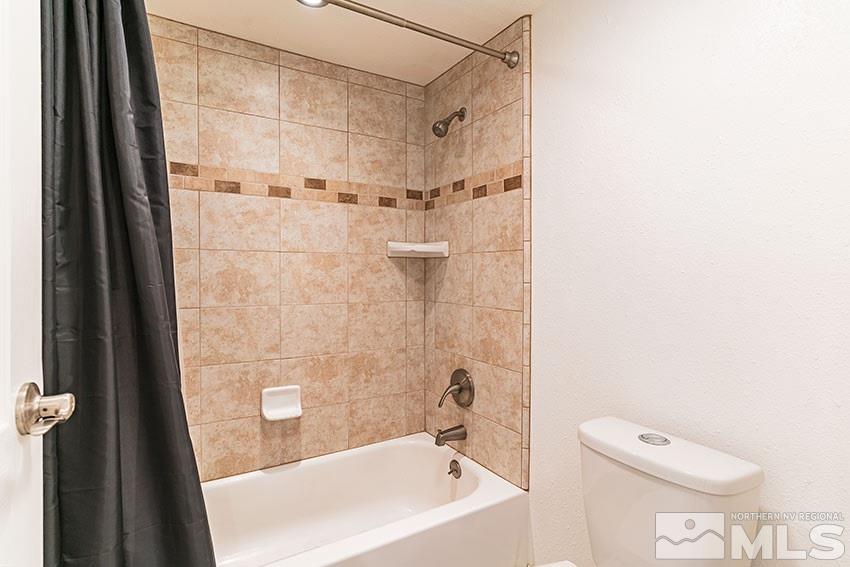 89 Vista Rafael Parkway Reno, NV 89503 - Photo 11 of 16 a bathroom with a bathtub and a shower