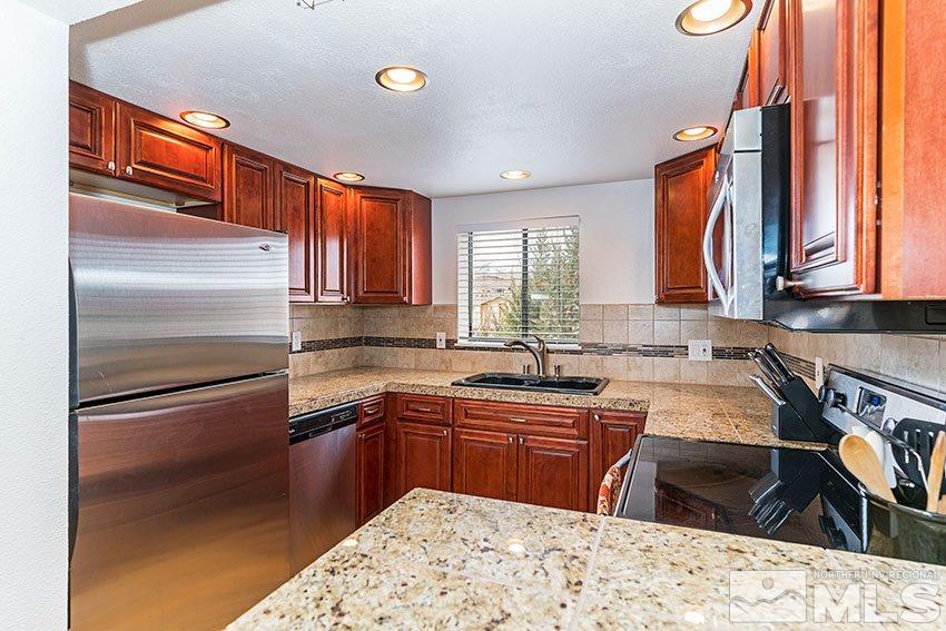 89 Vista Rafael Parkway Reno, NV 89503 - Photo 2 of 16 a kitchen with a sink appliances cabinets and a window