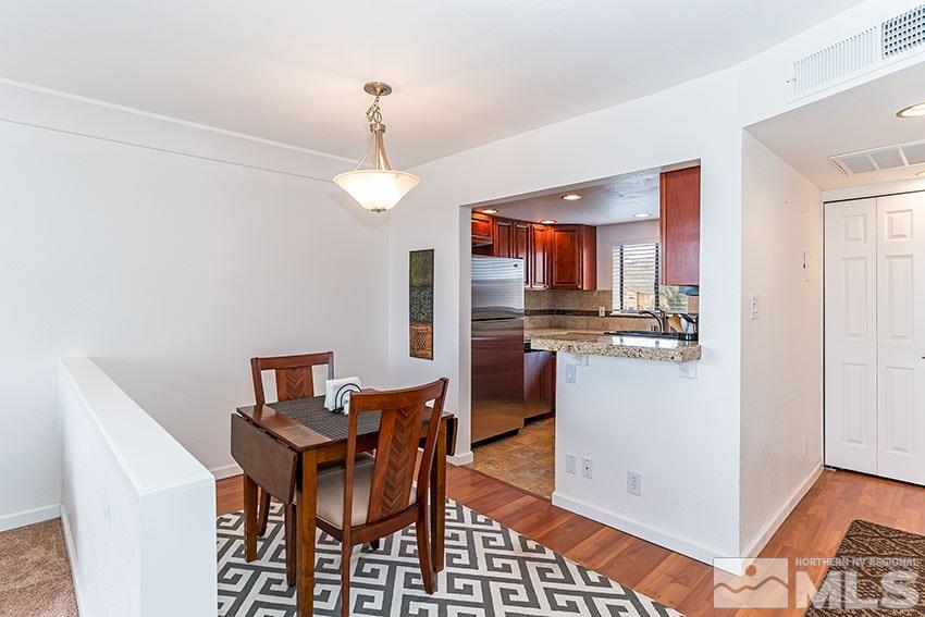 89 Vista Rafael Parkway Reno, NV 89503 - Photo 4 of 16 a view of a dining room with furniture and a chandelier