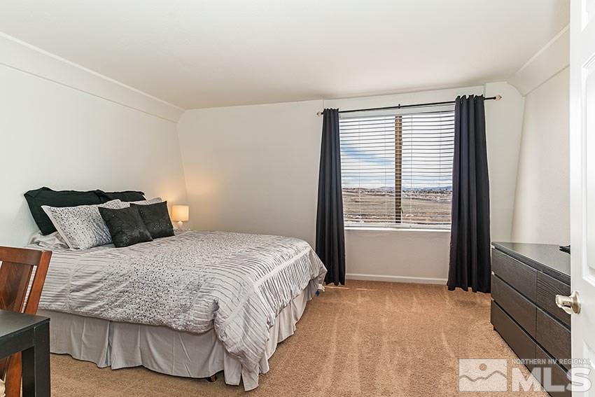 89 Vista Rafael Parkway Reno, NV 89503 - Photo 8 of 16 a bedroom with a bed and a window