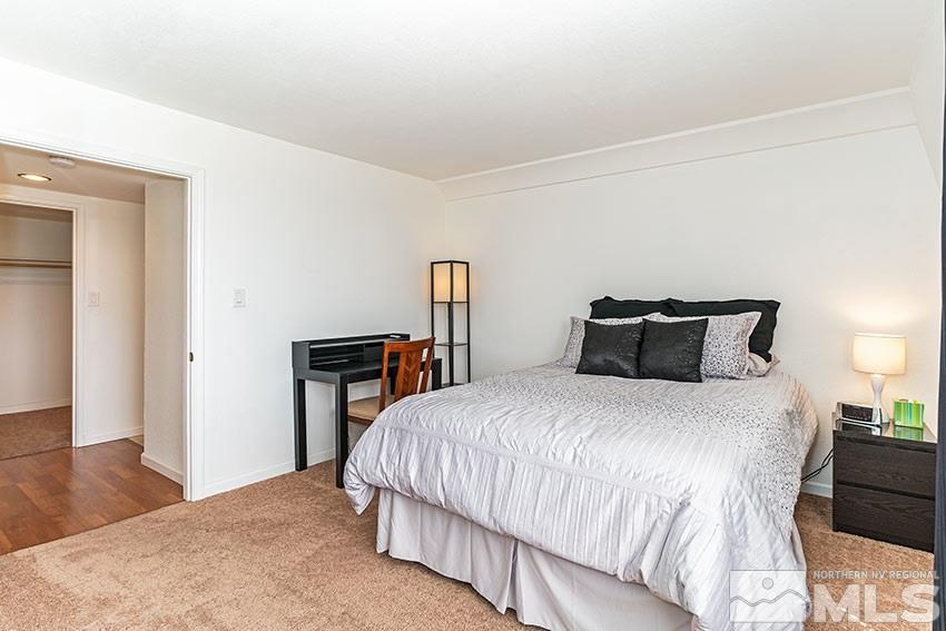 89 Vista Rafael Parkway Reno, NV 89503 - Photo 9 of 16 a bedroom with a bed and wooden floor
