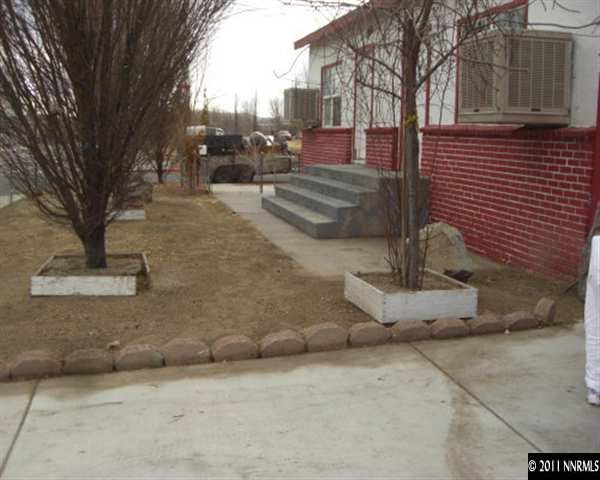 a view of a fire pit with iron fence
