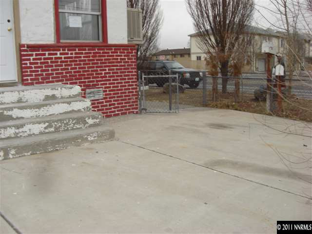 3743 Neil Road Reno, NV 89502 - Photo 3 of 6 a view of a brick building with many windows