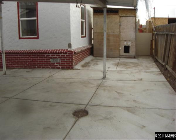 3743 Neil Road Reno, NV 89502 - Photo 5 of 6 a view of a parking space with wooden fence