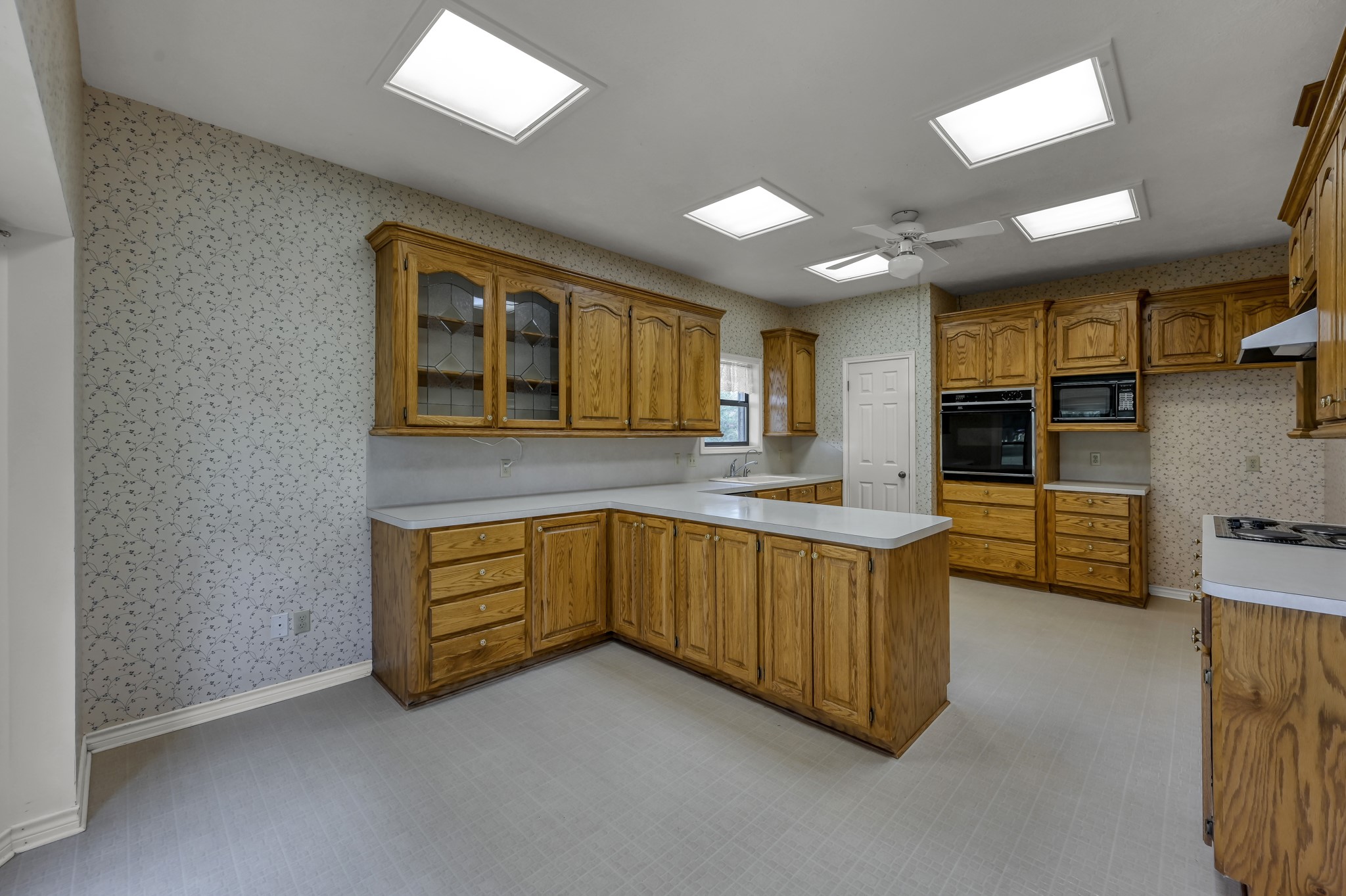 273 Augusta Drive Trinity, TX 75862 - Photo 5 of 21 The kitchen "peninsula" offers abundant counter and cabinet space.