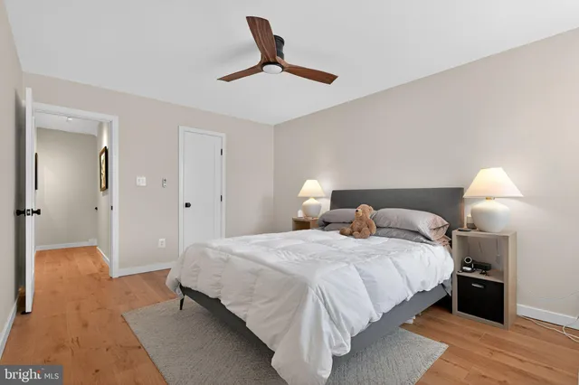 a bedroom with a bed and a lamp