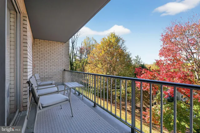 a balcony with view of outdoor space