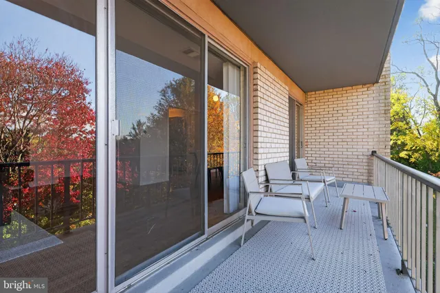 a view of a balcony with furniture