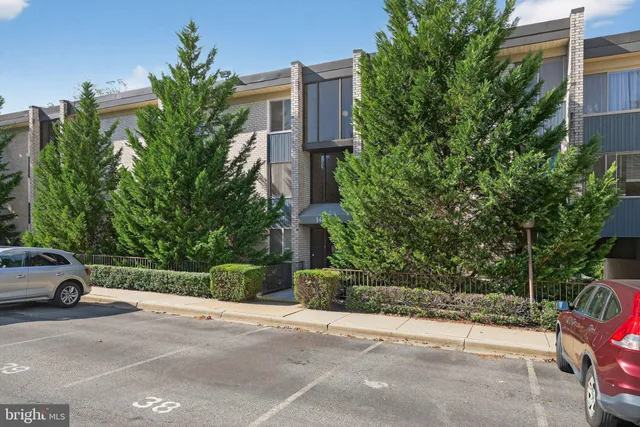a front view of a house with parking space