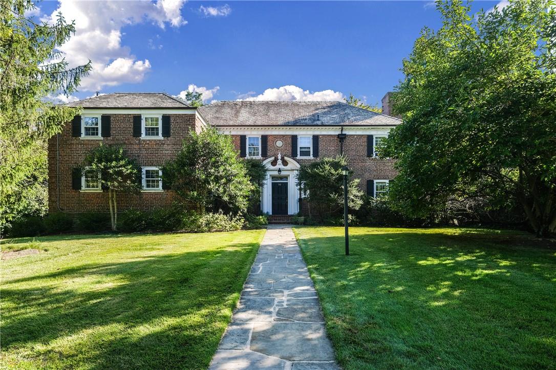 a house with garden in front of it