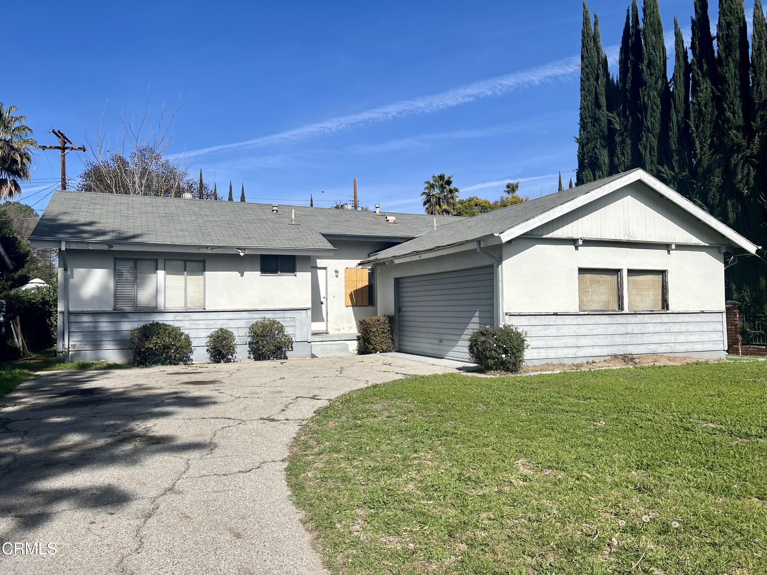 19211 Community Street Northridge, CA 91324 - Photo 1 of 17 a view of a house with a patio