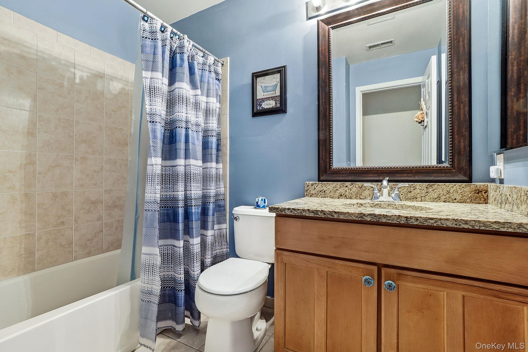 1604 Pondview Loop Wappingers Falls, NY 12590 - Photo 26 of 37 a bathroom with a granite countertop sink mirror vanity and toilet