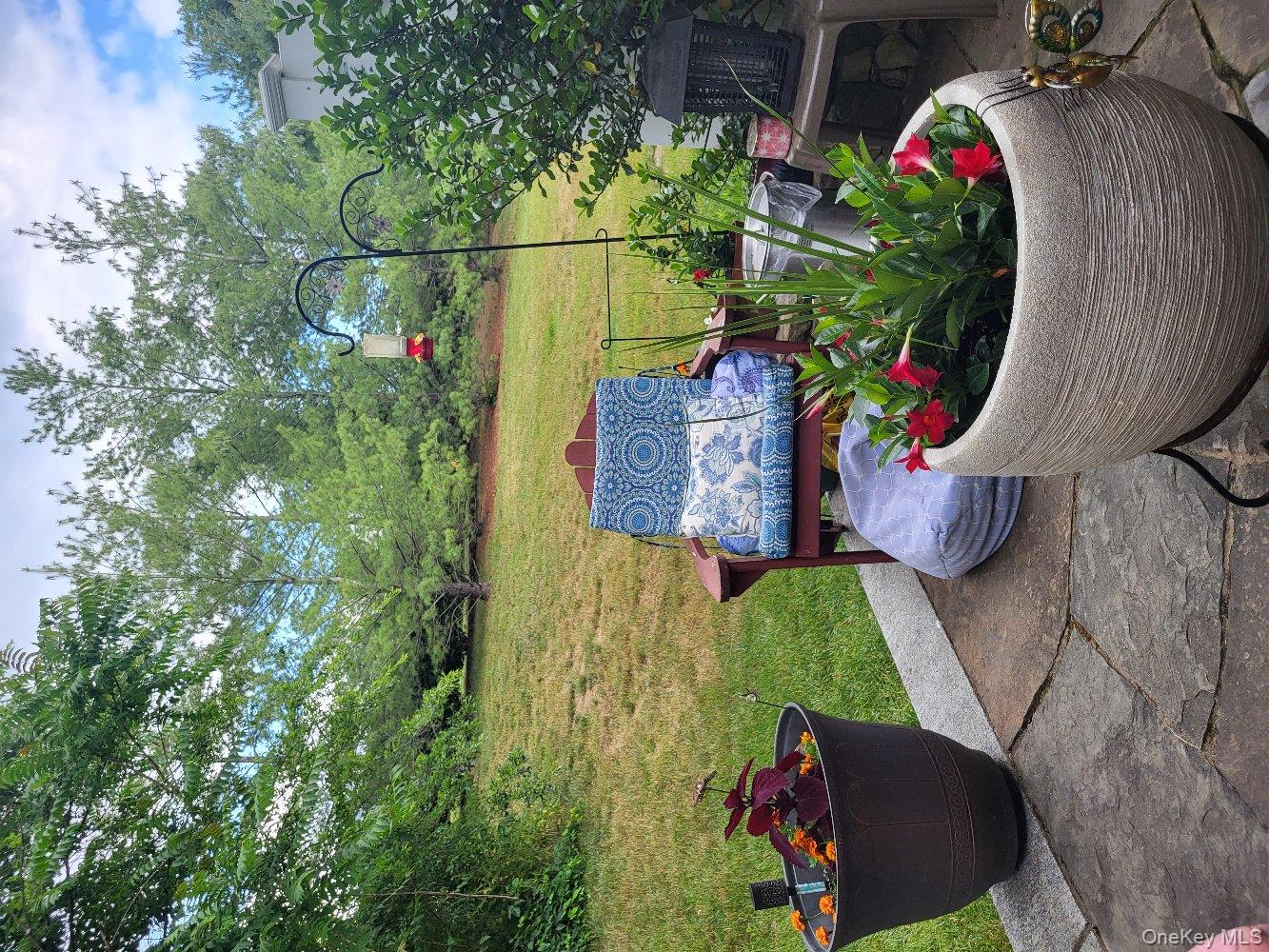 1604 Pondview Loop Wappingers Falls, NY 12590 - Photo 28 of 37 a view of a chair and table on the garden