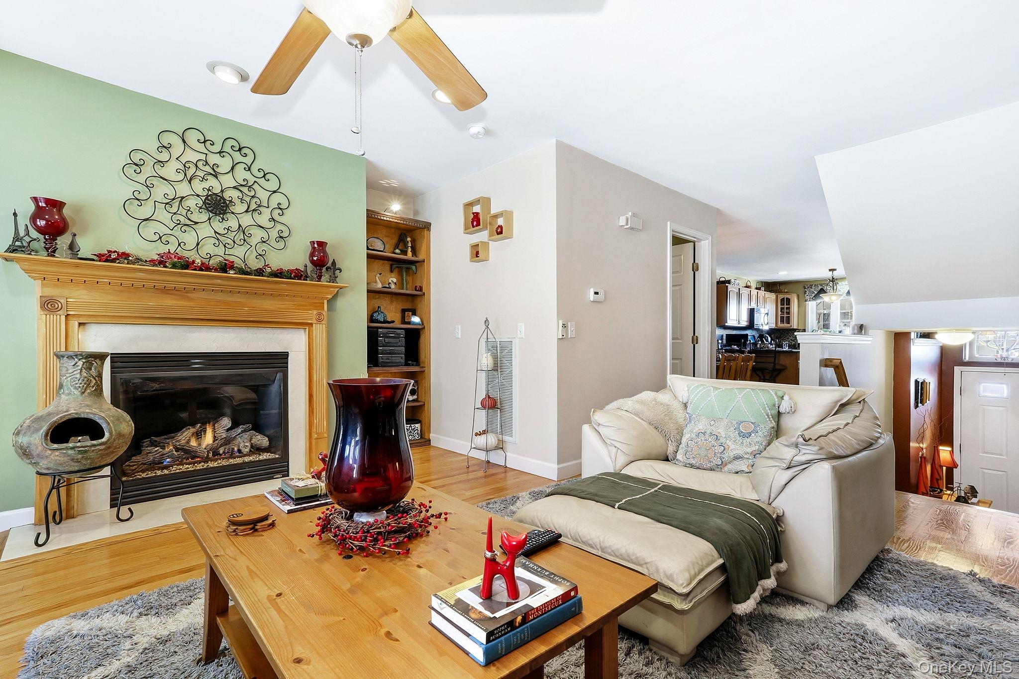 1604 Pondview Loop Wappingers Falls, NY 12590 - Photo 6 of 37 a living room with furniture and a fireplace