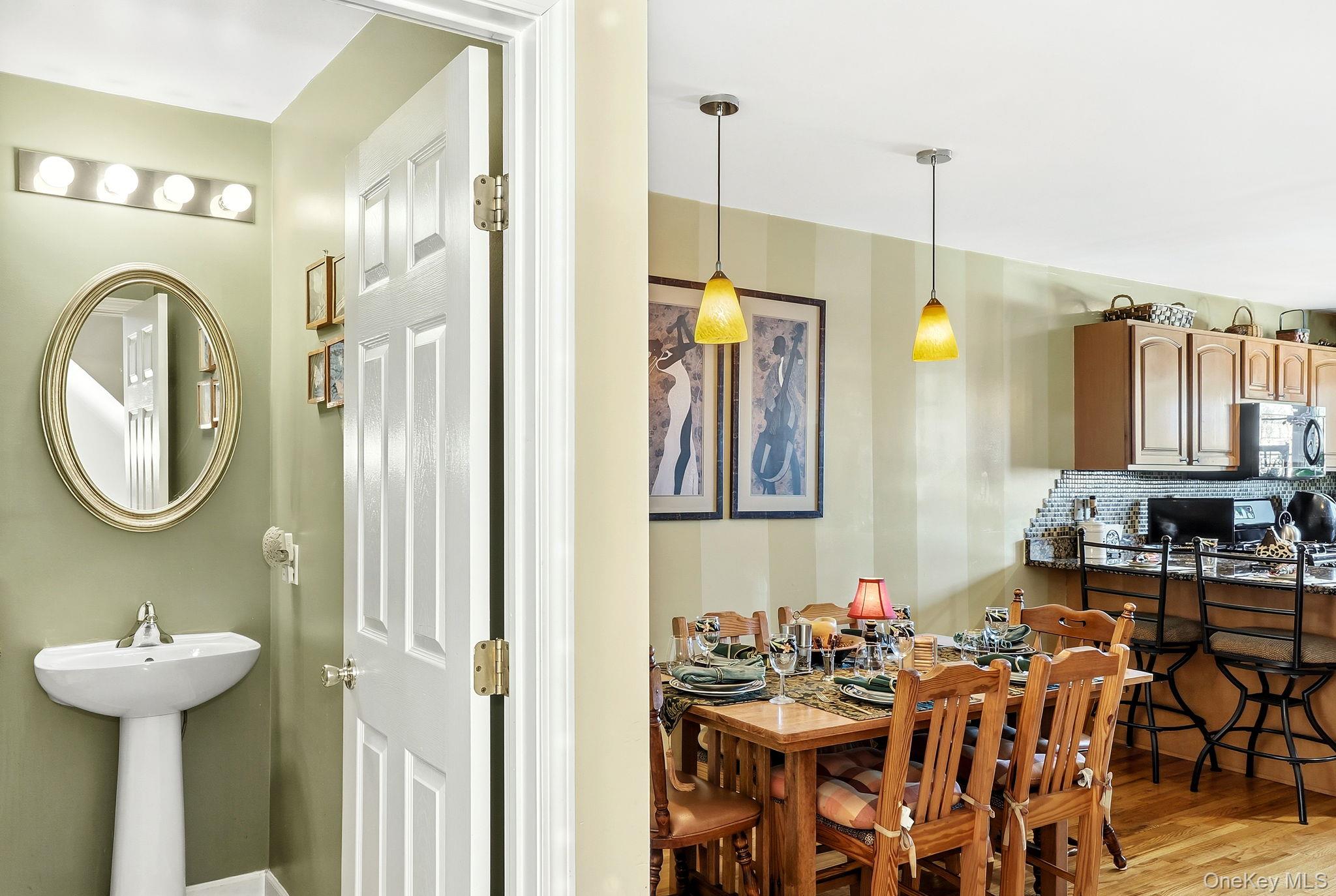 1604 Pondview Loop Wappingers Falls, NY 12590 - Photo 10 of 37 a bathroom with a sink double vanity and a mirror
