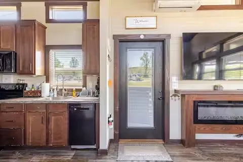 a kitchen with stainless steel appliances granite countertop a refrigerator and a stove