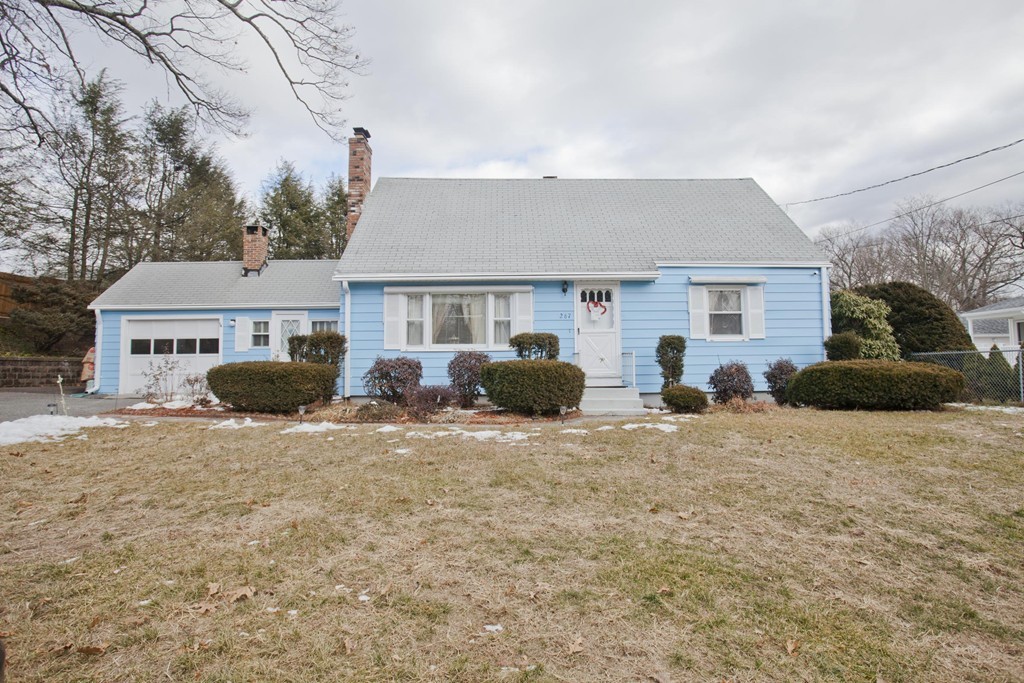 267 Shawmut Street Springfield, MA 01108 - Photo 1 of 30 a front view of a house with a yard