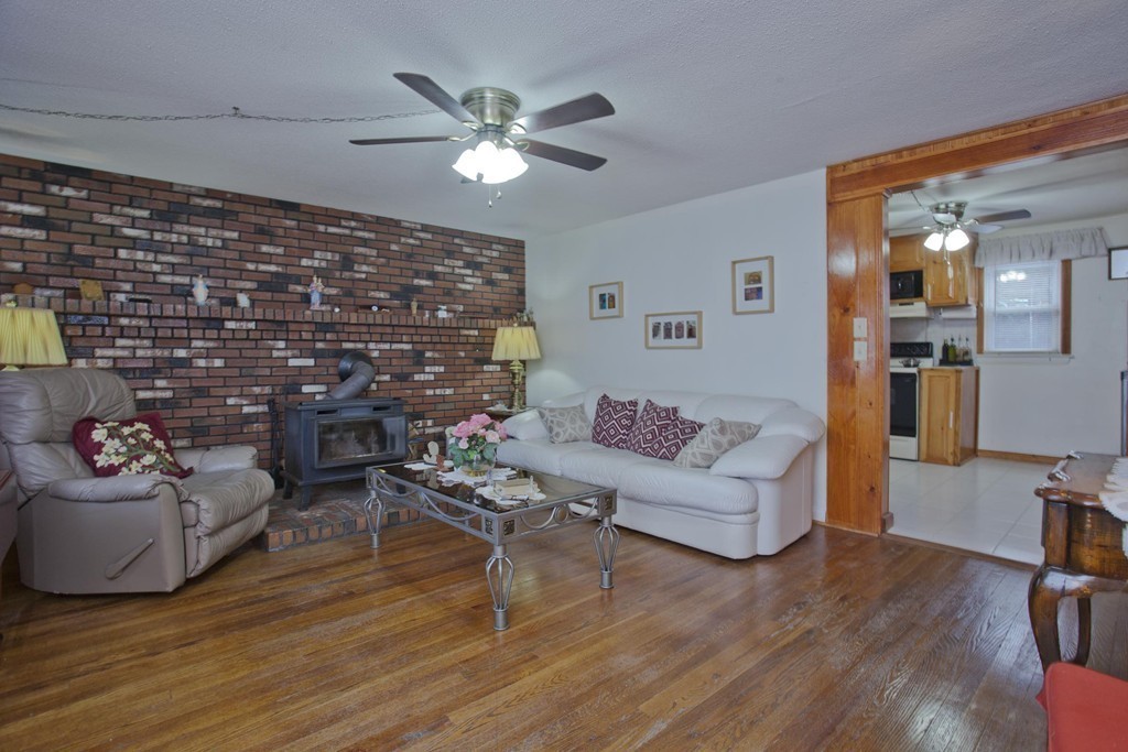 267 Shawmut Street Springfield, MA 01108 - Photo 12 of 30 a living room with furniture and wooden floor