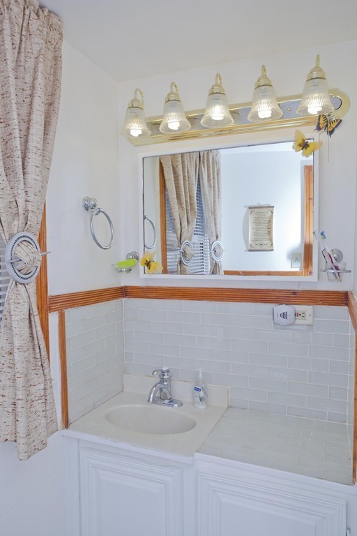 267 Shawmut Street Springfield, MA 01108 - Photo 23 of 30 a bathroom with a sink and a mirror