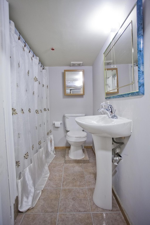 267 Shawmut Street Springfield, MA 01108 - Photo 27 of 30 a bathroom with a sink toilet and shower