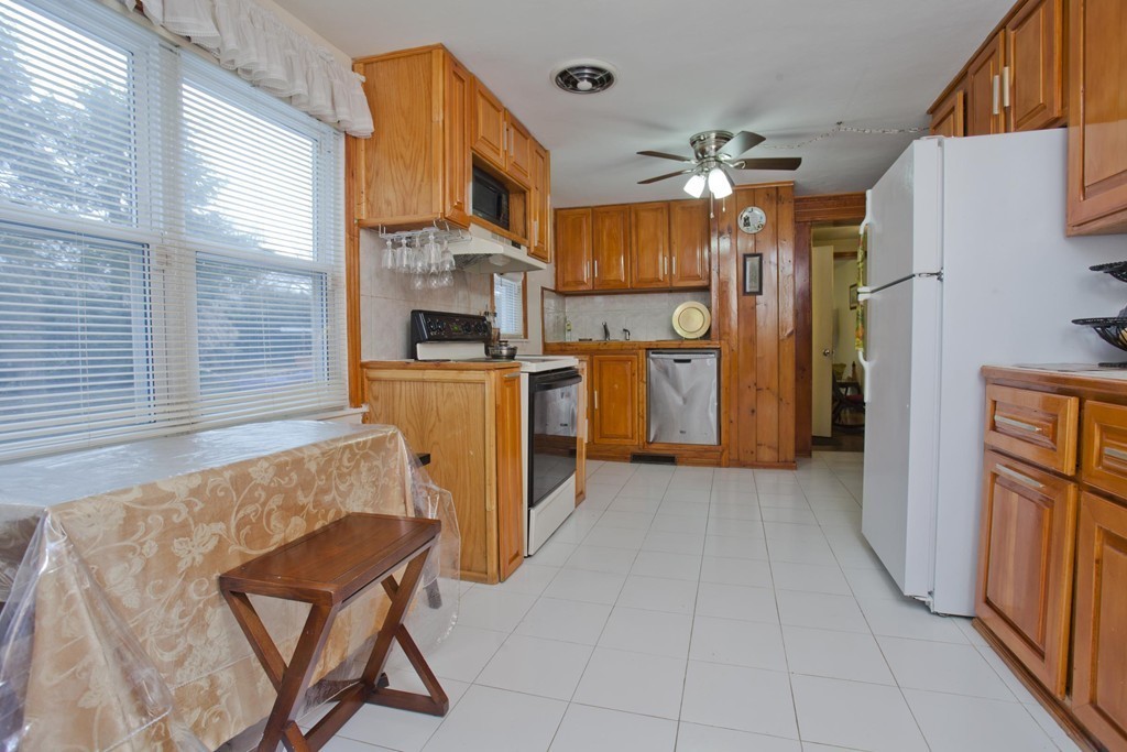 267 Shawmut Street Springfield, MA 01108 - Photo 6 of 30 a view of a kitchen with furniture and a kitchen