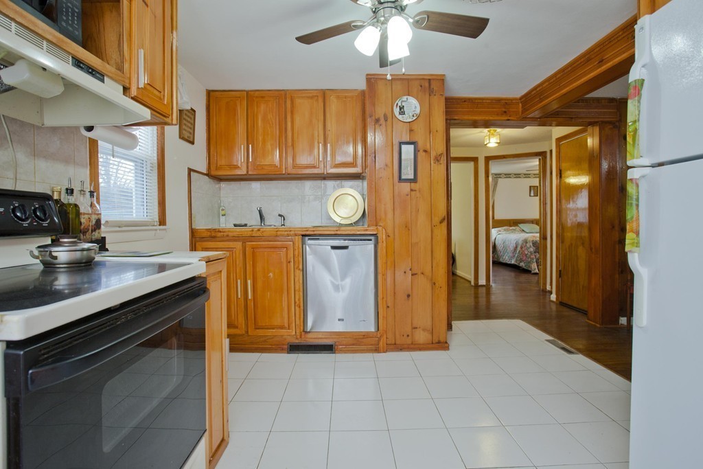 267 Shawmut Street Springfield, MA 01108 - Photo 8 of 30 a view of a kitchen with a sink and cabinets
