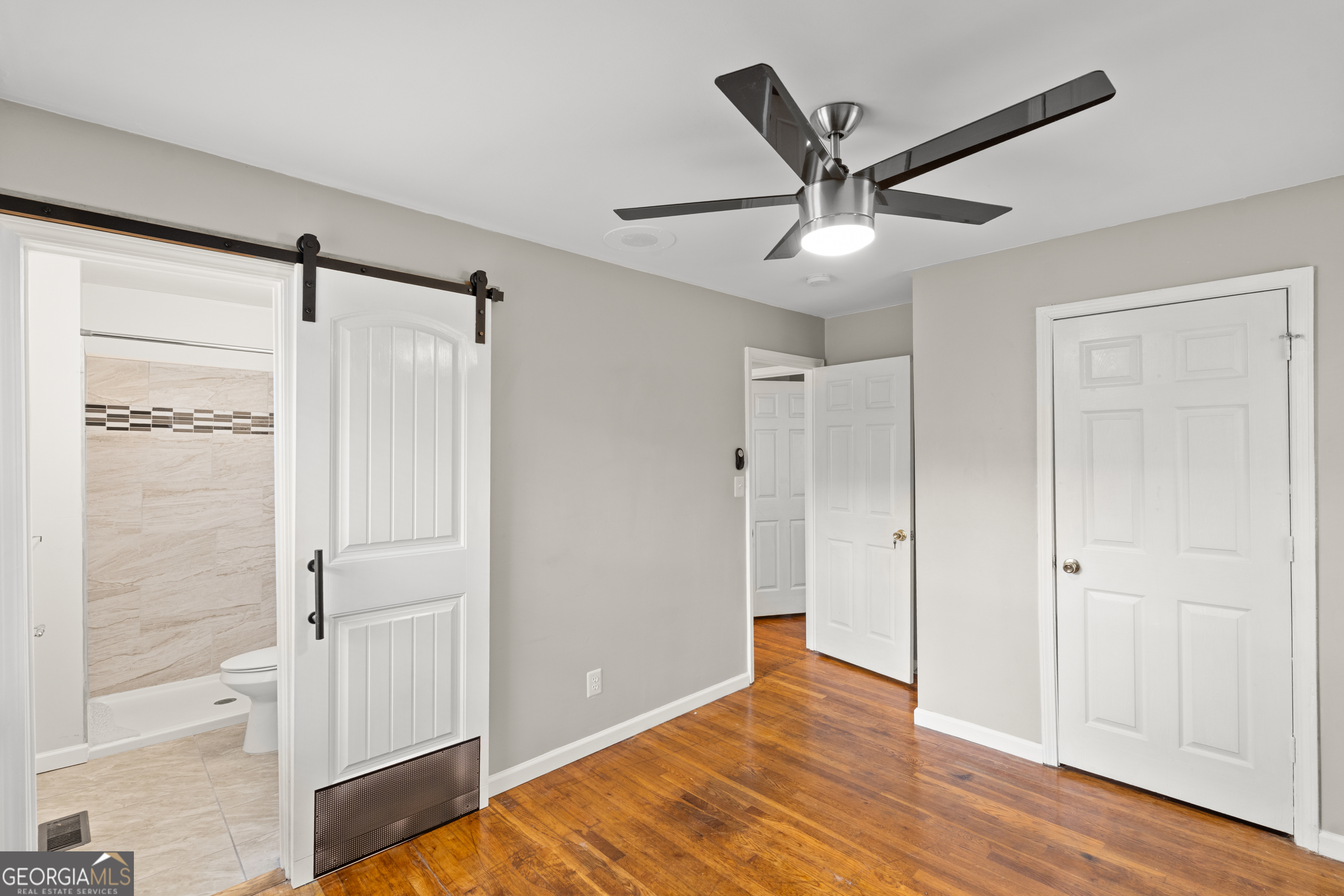 2161 Rochelle Way South Fulton, GA 30349 - Photo 15 of 20 a view of a livingroom with a ceiling fan and wooden floor