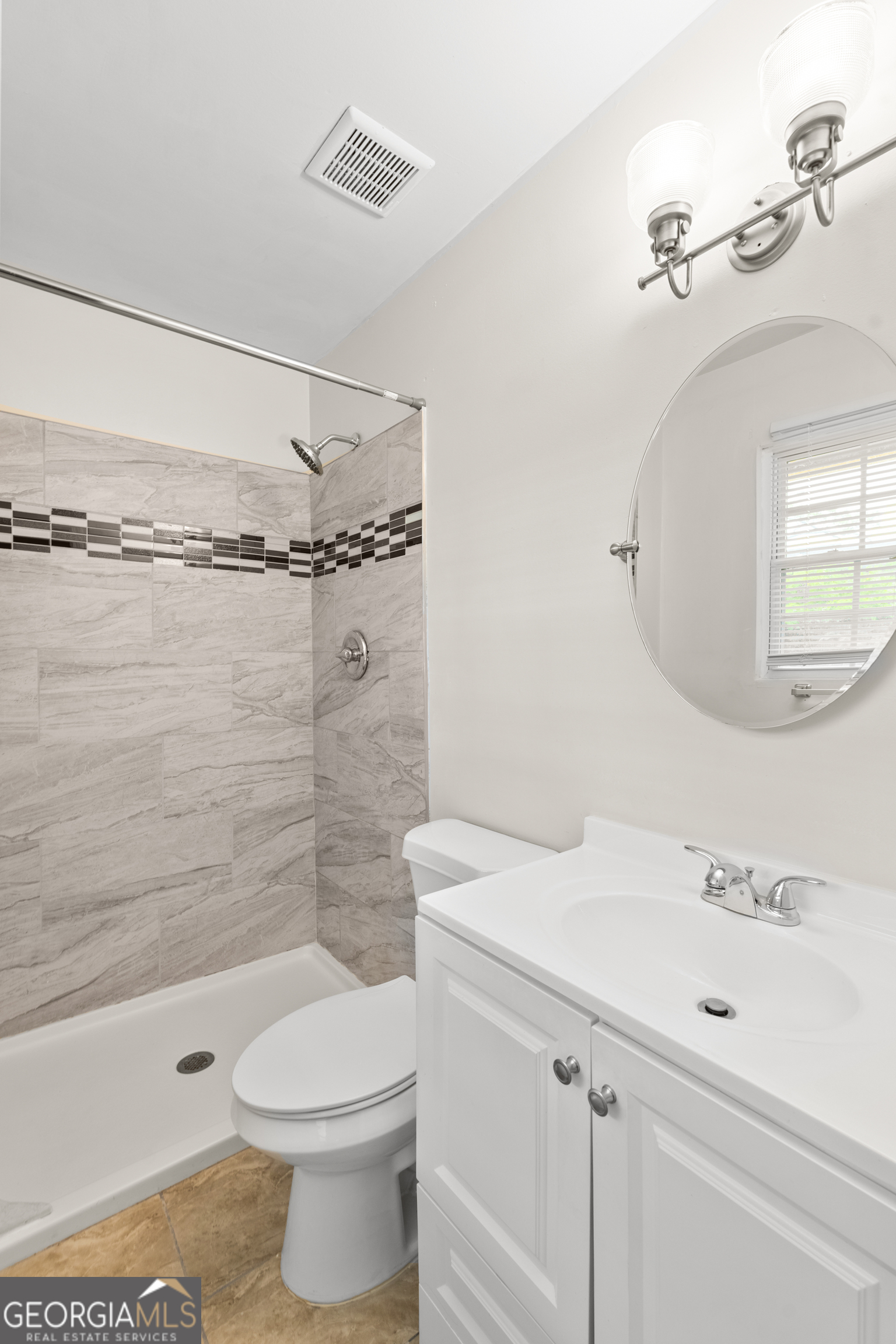 2161 Rochelle Way South Fulton, GA 30349 - Photo 16 of 20 a bathroom with a sink a toilet and shower
