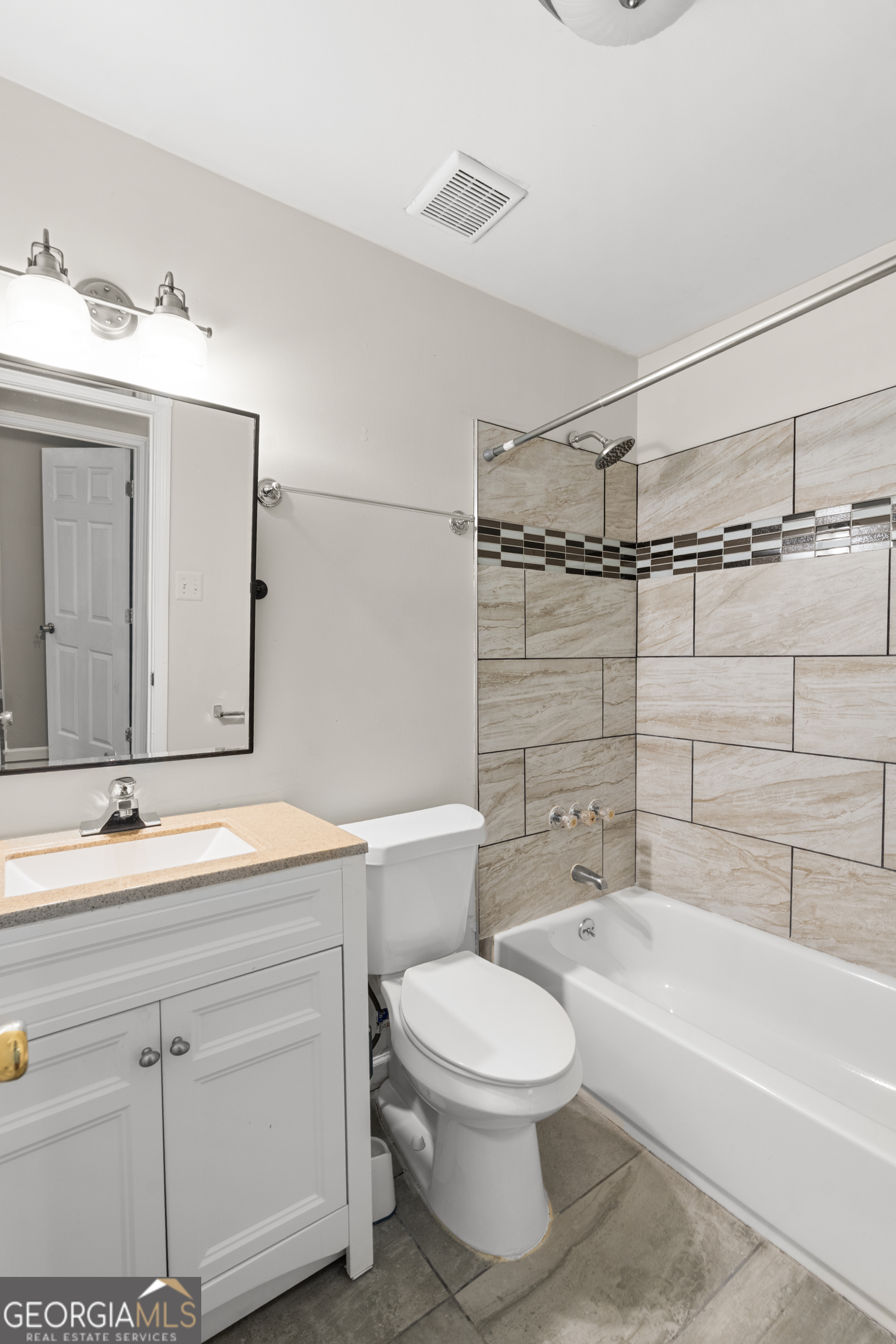 2161 Rochelle Way South Fulton, GA 30349 - Photo 17 of 20 a bathroom with a sink a toilet and bathtub