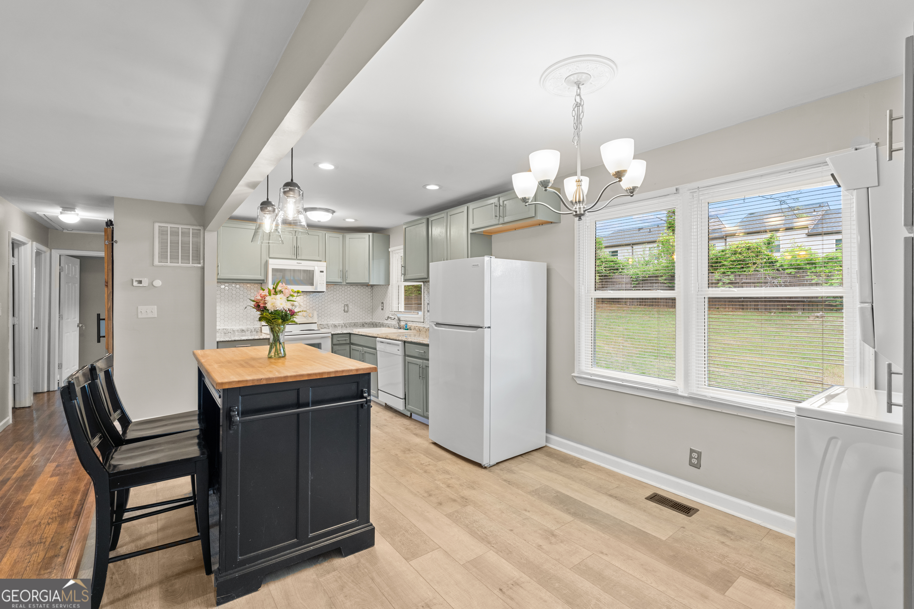 2161 Rochelle Way South Fulton, GA 30349 - Photo 5 of 20 a room with stainless steel appliances kitchen island granite countertop furniture and a large window