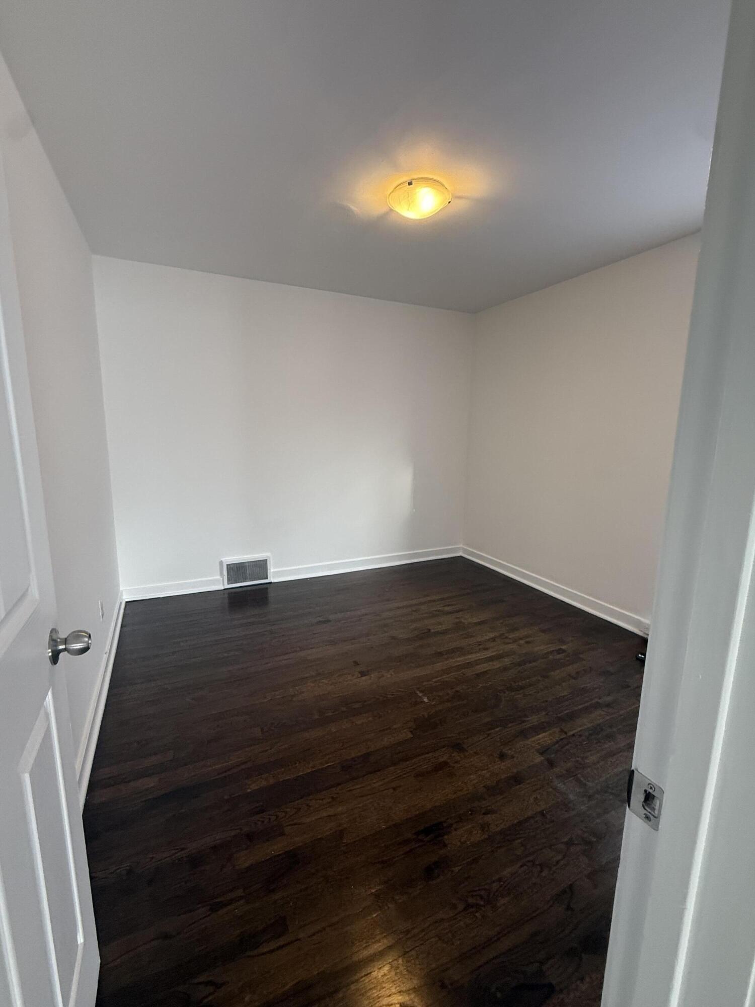 541 Chase Street Gary, IN 46404 - Photo 7 of 13 a view of an empty room and wooden floor