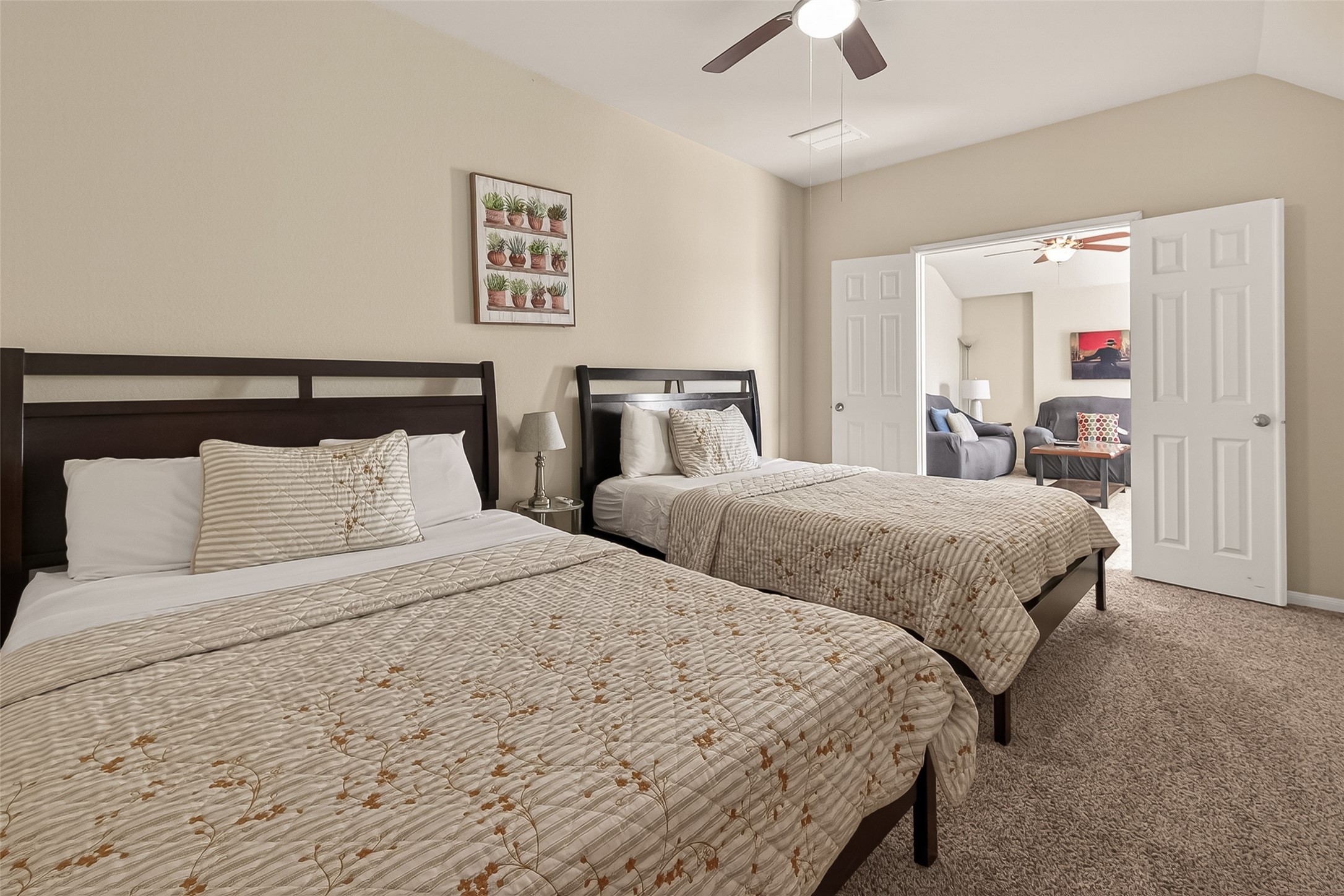 4508 Coopers Hl Trail Rosenberg, TX 77471 - Photo 25 of 43 a bedroom with double bed and a chandelier