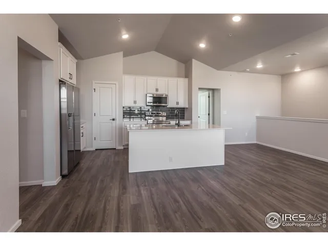 a view of a kitchen with wooden floor