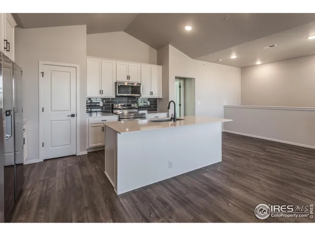 a view of kitchen with wooden floor