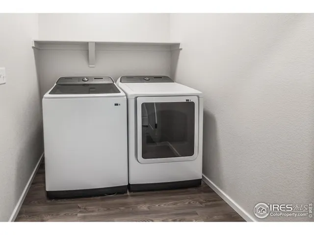 an empty room with windows and entrance