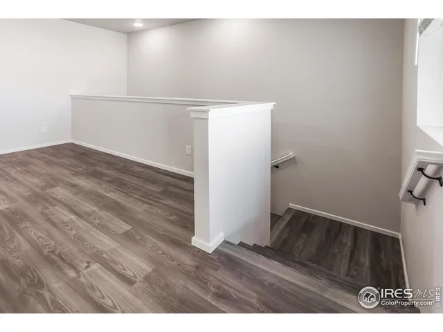 a view of wooden floor in an empty room