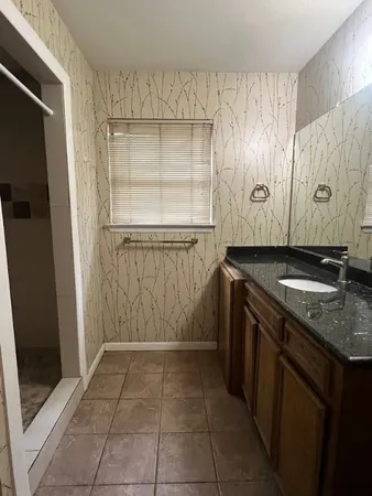a white toilet sitting next to a shower curtain