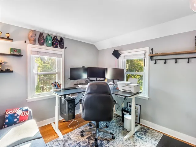 a workspace with furniture and a window