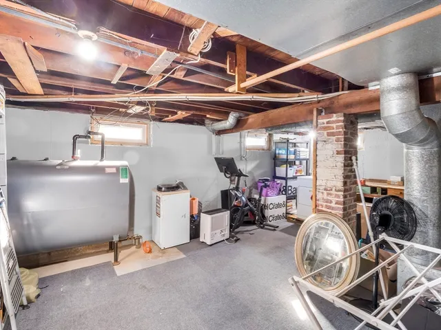 a front view of house with yard and trees around